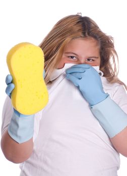 A young girl plugging her nose because of a bad smelling cleaning sponge, isolated against a white background