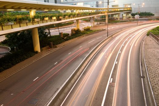It is traffic with cars motion blurred in Hong Kong.