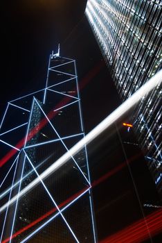 Night scenes of skyscraper with cars motion blurred light in Hong Kong.