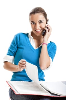 Beautiful female student making a phone call isolated on white