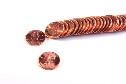 The American cents lie abreast on a white background.