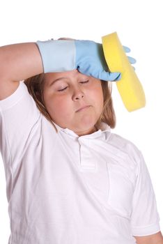 A young girl is wiping her forehead because she is tired of cleaning, isolated against a white background