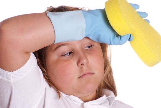 A young girl is wiping her forehead because she is tired of cleaning, isolated against a white background
