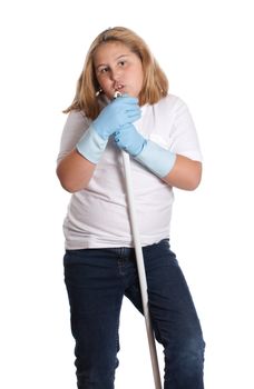 A young girl singing into a handle while she cleans, isolated against a white background