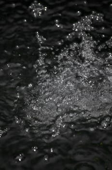 closeup of water splashing with lots of bubbles