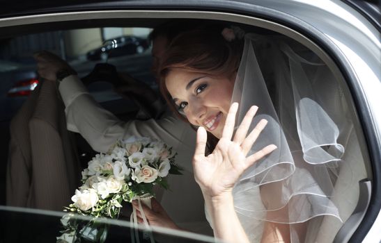 Beautiful bride in car
