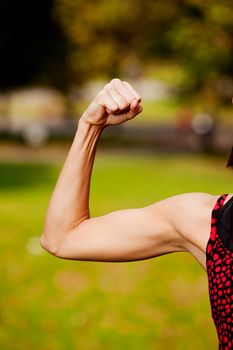 A female flexing her bicep muscle