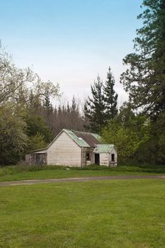 An old farm building sits on the edge of bush in Wanstead, Cental Hawkes Bay, New Zealand.