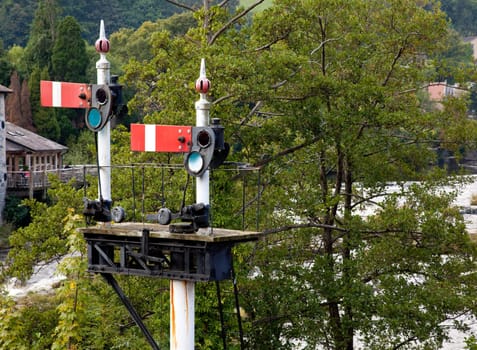 Railway signals at stop using the obselete semaphone system in Llangollen in Wales