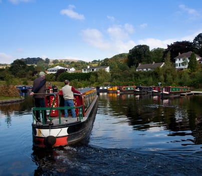 Old barge turning into boatyard on canal near Llangollen in Wales