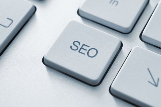 SEO button on the keyboard. Toned Image.