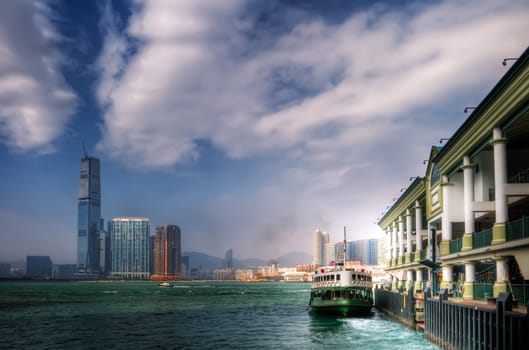Ferry leave the dock Victoria Harbor in Hong Kong.