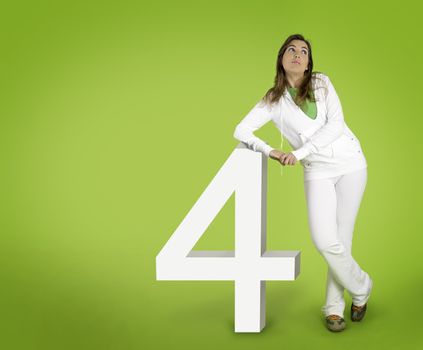 Woman contemplating questions with 3D forms on a green background