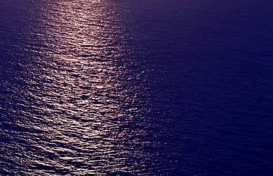 The sun setting on calm waters of the Mediterranean Sea