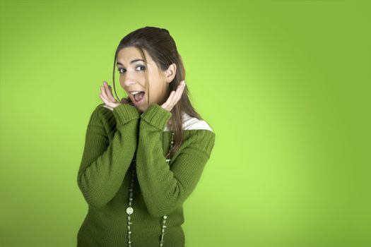 Happy beautiful model on a green background