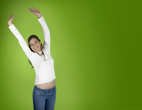 Beautiful and happy young woman on a green background