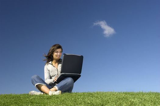 Woman in outdoor study with a laptop