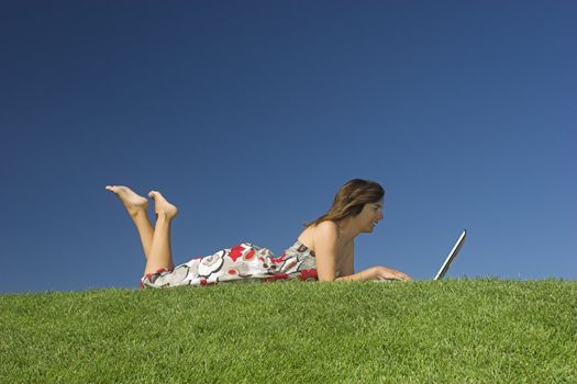 Woman in outdoor study with a laptop
