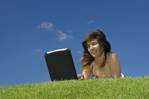 Woman in outdoor study with a laptop