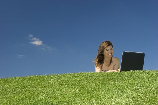 Woman in outdoor study with a laptop