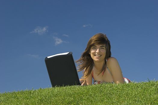 Woman in outdoor study with a laptop