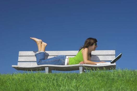 Woman in outdoor study with a laptop