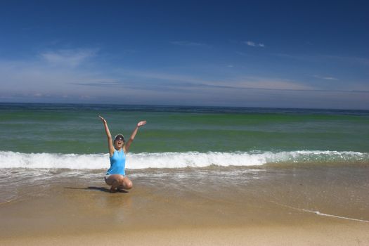 Beautiful woman happy with the great day on the beach