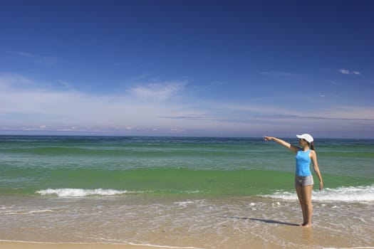 Beautiful woman on the beach showing some interesting