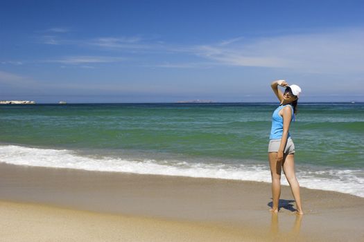 Beautiful happy woman on a wonderful beach
