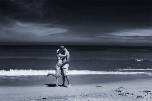 Couple of boyfriends kissing on the beach (toned in PS)