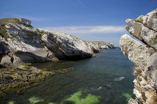 Beautiful blue beach with rocks and turquoise water