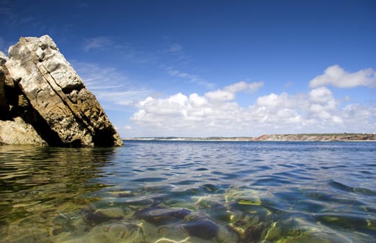 Beautiful blue beach with rocks and turquoise water