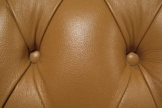 Brown genuine leather upholstery texture. closeup. Useful as background for design-works.