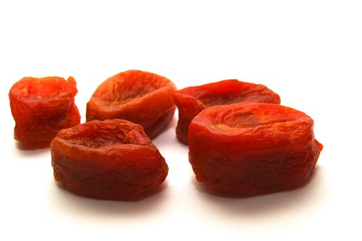 photo of the dried apricots on white background