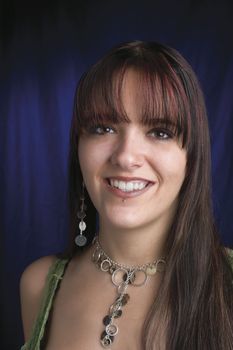 fashion model in relaxe position with blue light reflecting on background