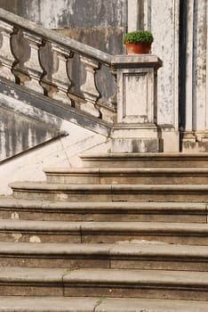 beautiful staircase at a local garden with a flower vase and stone steps