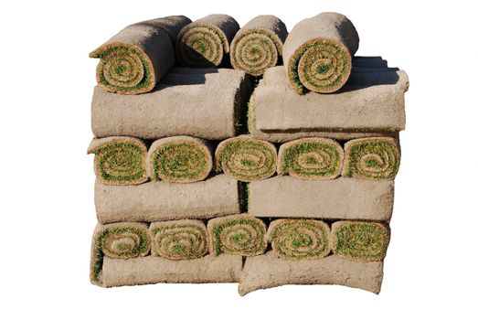 healthy green rolls of sod ready to be installed (isolated over white)