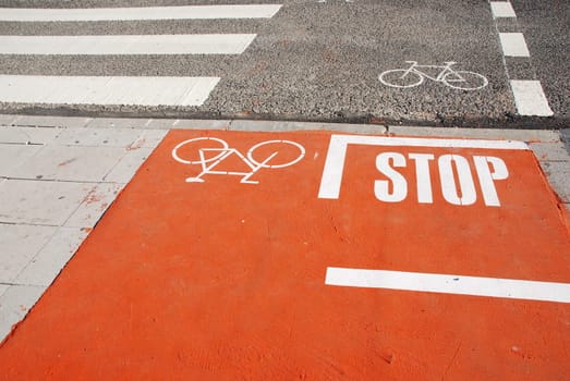 photo of a bicycle lane on a urban road with a pedestrian crossing