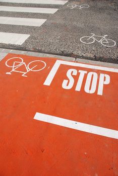 photo of a bicycle lane on a urban road with a pedestrian crossing