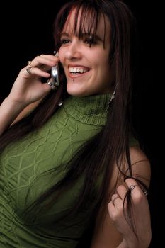 Twenty something fashion model holding cell phone with big smile