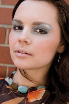 Head shot of a twenty something fashion with funky makeup