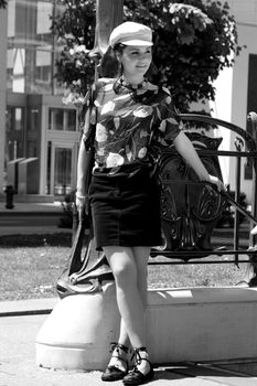 Twenty something urban fasion model hanging around a metro entrance in montreal that looks like a New York metro station