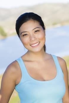Outdoor Portrait of a Smiling Young Asian Woman