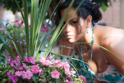 Twenty something columbian fashion model enjoying a sunny day in a garden