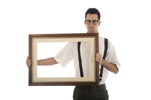 A young, caucasian nerd, holding up a frame, isolated on a white background.