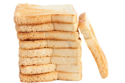 Tower of toasts, with one slice leaning on the side, isolated on white background