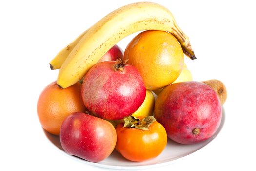 Pile of fruits on  plate isolated on white background