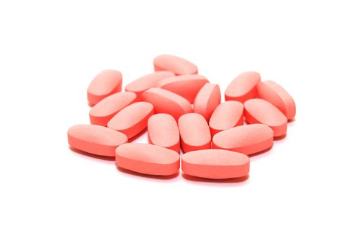 photo of the pink pills  on white background