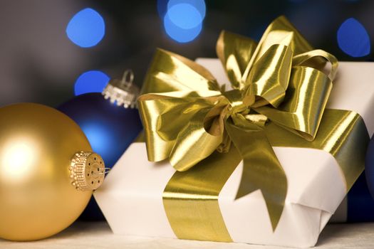 Gift with gold bow and ornament