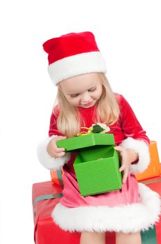 Christmas toddler with present boxes, studio shot